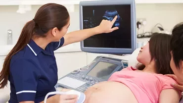 Medical professional conducting an ultrasound on a patient.