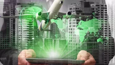 Airplane and digital graphics overlaid on a cityscape, with hands holding a tablet.